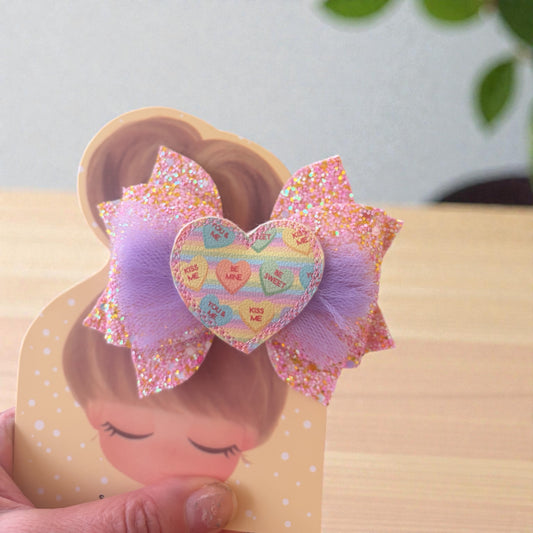 Glitter, pink and lavender hair bow with conversation heart